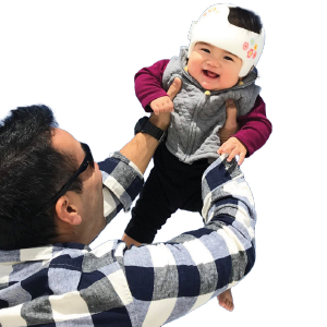 Father playing airplane with his daughter