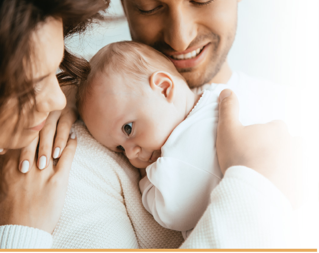 Family with newborn ear molding treatment