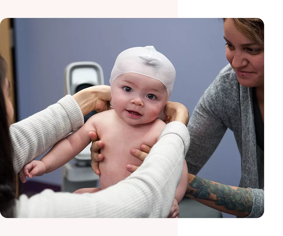 baby receiving a head shape assessment at a cranial technologies clinic