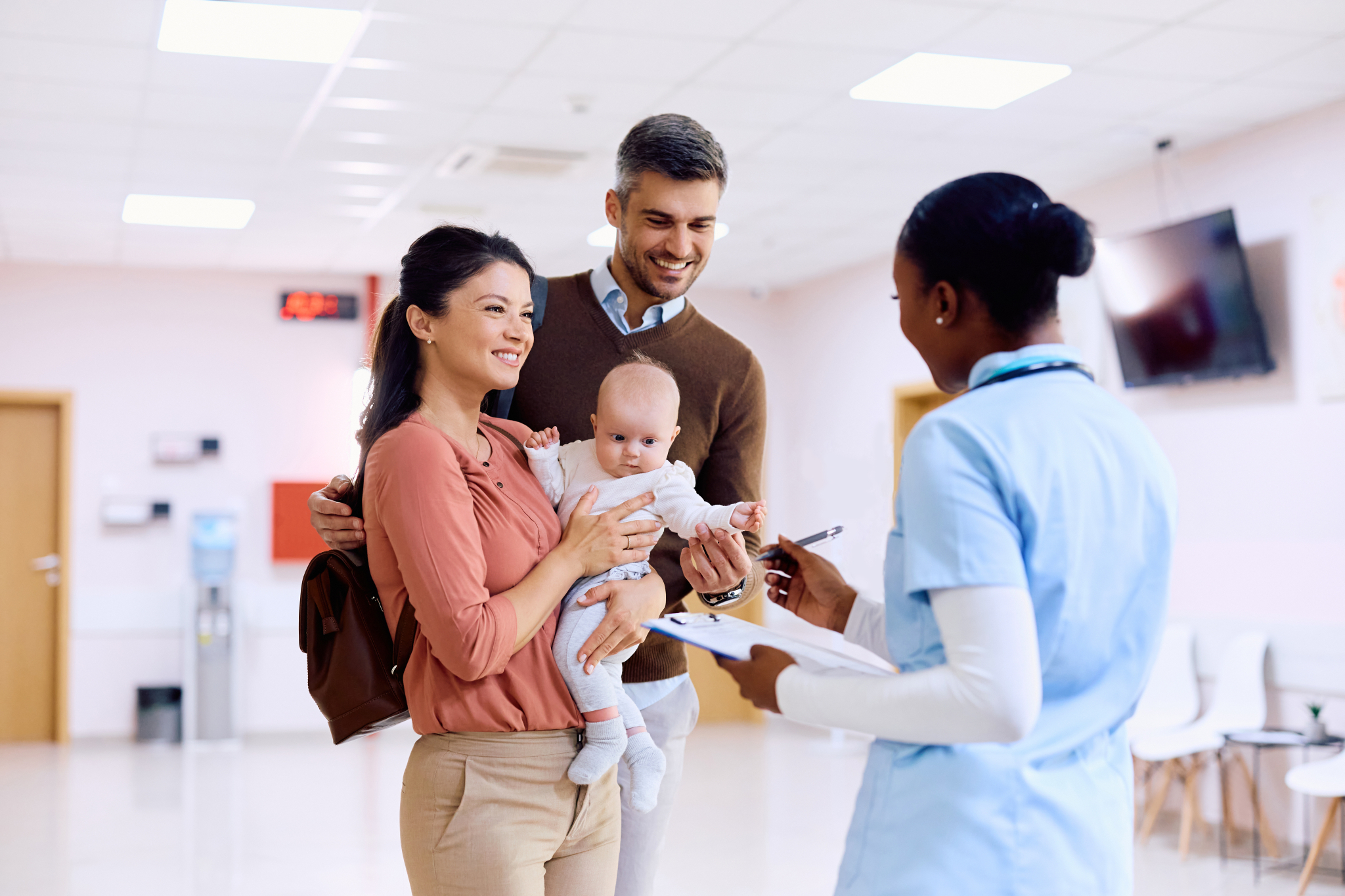 Pediatrician talking to a family