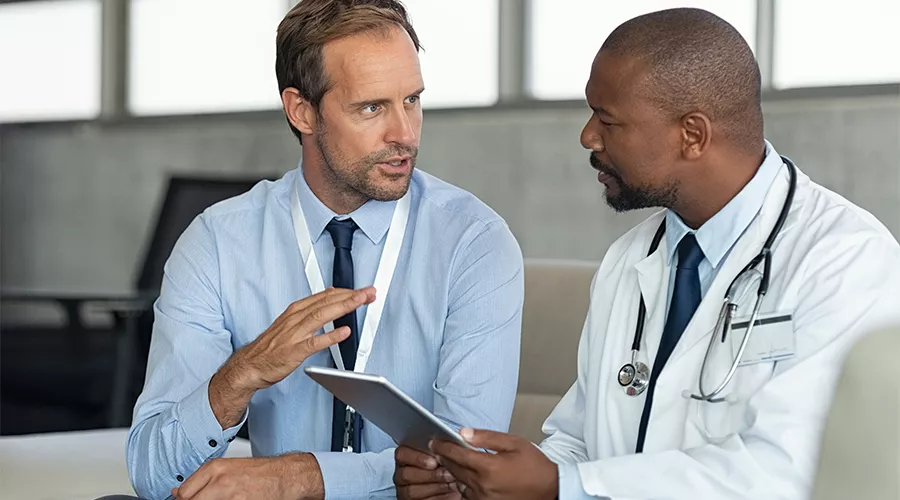 Sales representative talking with a doctor