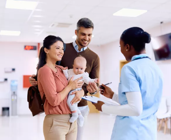 Pediatrician talking to a family